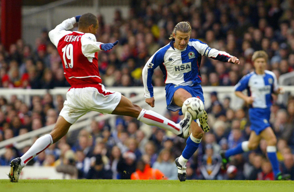 Arsenal's Gilberto (L) stretches to take